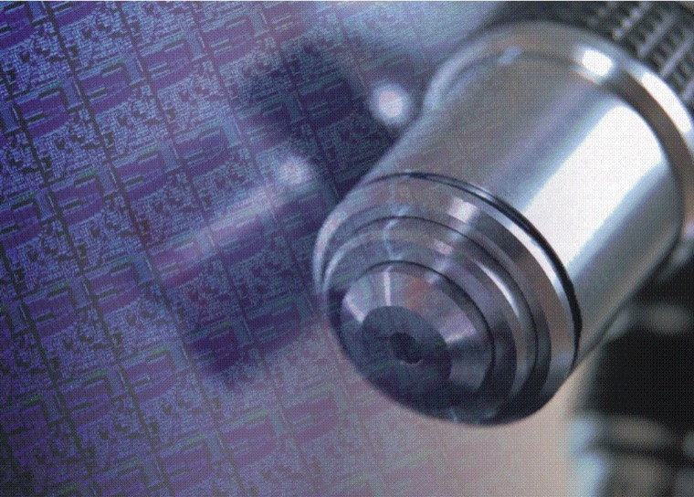 A microscope objective inspecting a wafer